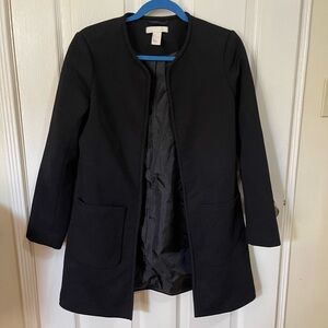 H&M collarless black coat jacket with front pockets fully lined.